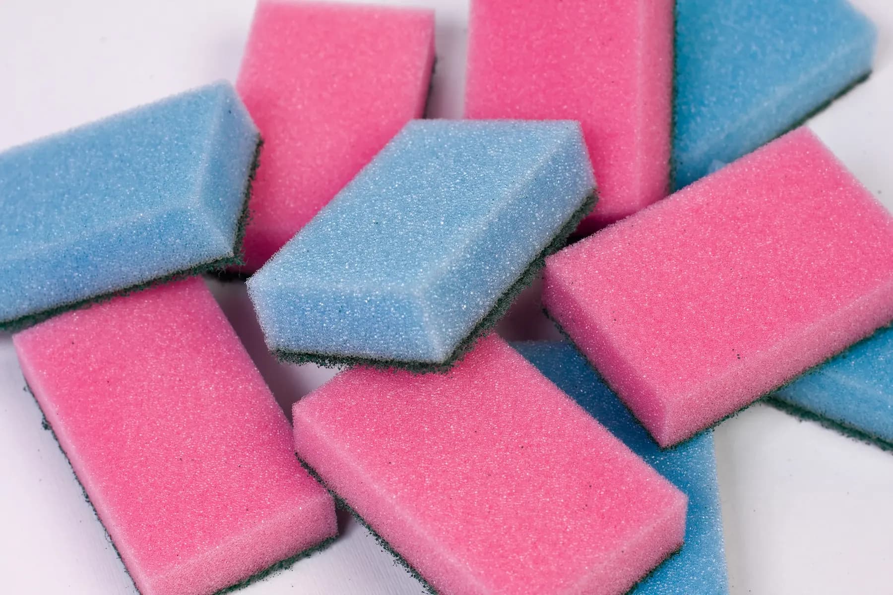 Fresh cleaning sponges laid out before a visit